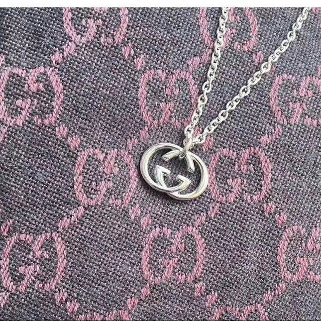 GUCCI 26S INTERLOCKING G LOGO PENDANT NECKLACE IN SILVER TONE METAL