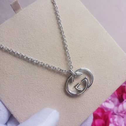 GUCCI 26S INTERLOCKING G LOGO PENDANT NECKLACE IN SILVER TONE METAL