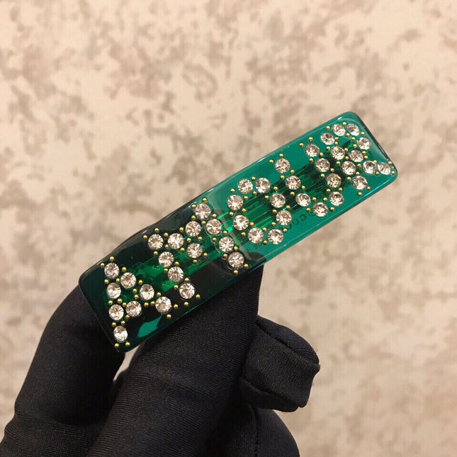 GUCCI 26S CRYSTAL LOGO HAIR CLIP IN GREEN RESIN AND GOLD TONE METAL