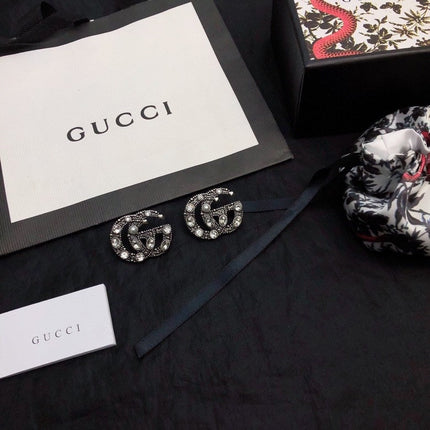 GUCCI 26S DOUBLE G LOGO CRYSTAL EMBELLISHED STATEMENT BROOCH IN SILVER TONE METAL 629029