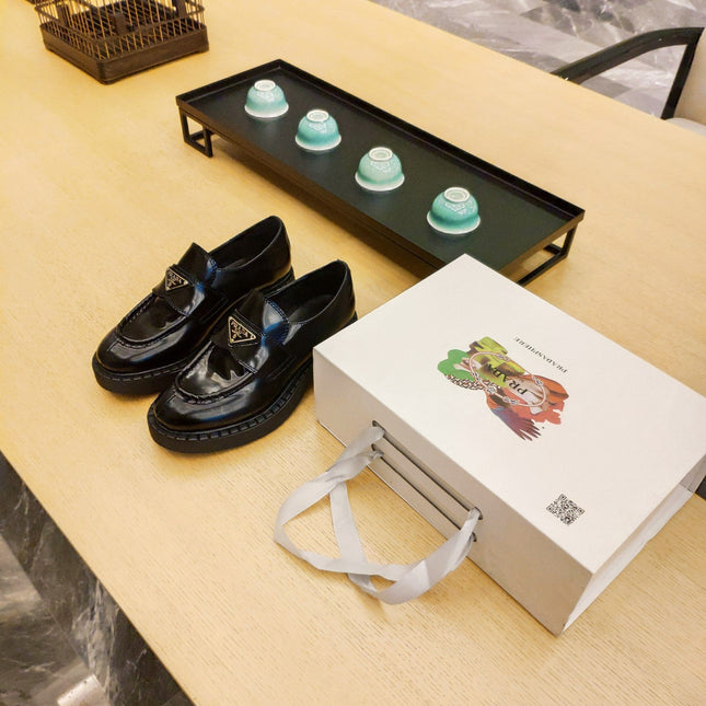 PRADA 26S PENNY LOAFERS 55MM IN DARK GREEN PATENT CALFSKIN