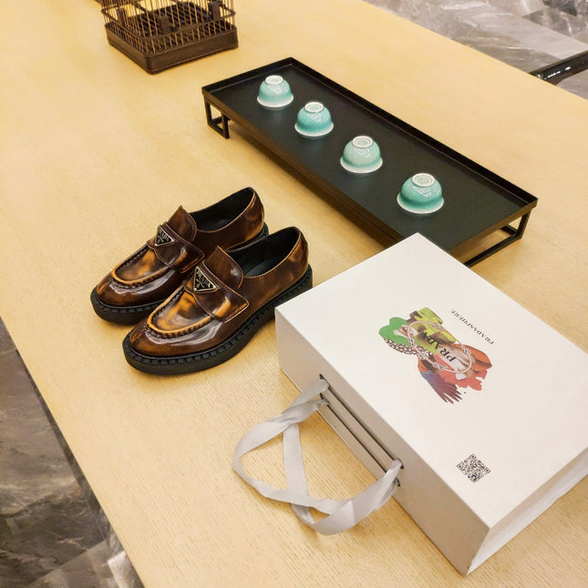 PRADA 26S PENNY LOAFERS 55MM IN BROWN PATENT CALFSKIN