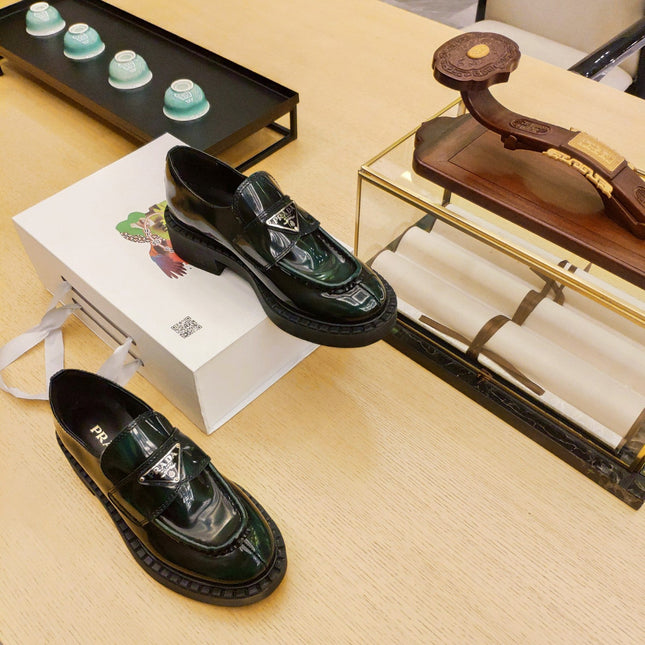 PRADA 26S PENNY LOAFERS 55MM IN GREEN PATENT CALFSKIN