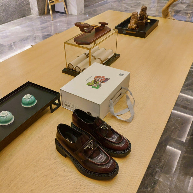 PRADA 26S PENNY LOAFERS 55MM IN BURGUNDY RED PATENT CALFSKIN