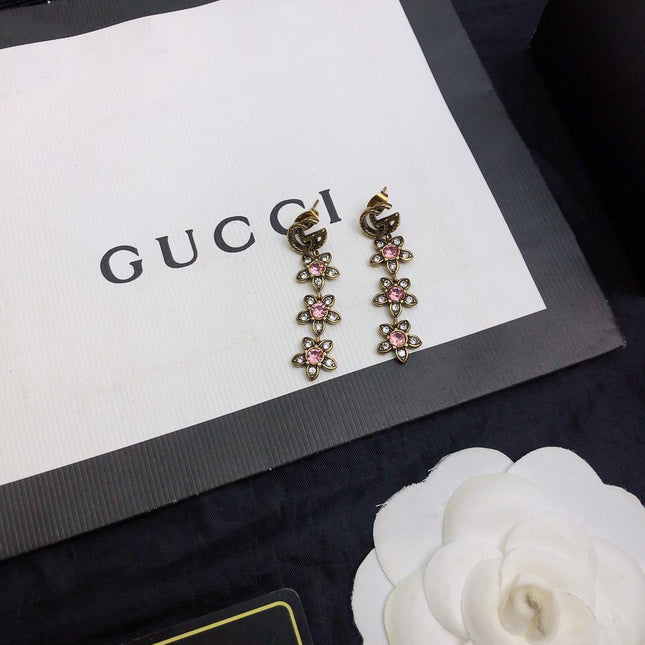 GUCCI 26S DOUBLE G LOGO PINK CRYSTAL FLORAL DROP EARRINGS IN AGED GOLD TONE METAL 629030