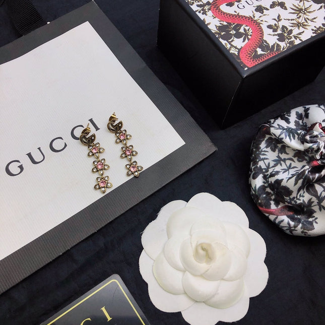 GUCCI 26S DOUBLE G LOGO PINK CRYSTAL FLORAL DROP EARRINGS IN AGED GOLD TONE METAL 629030
