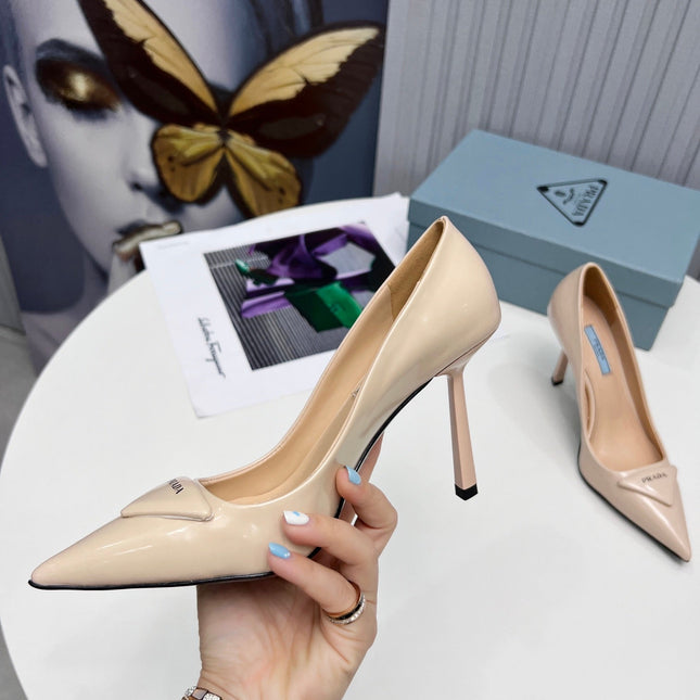 PRADA 26S POINTED TOE PUMPS STILETTO HEEL 95MM IN NUDE BEIGE PATENT CALFSKIN LOGO