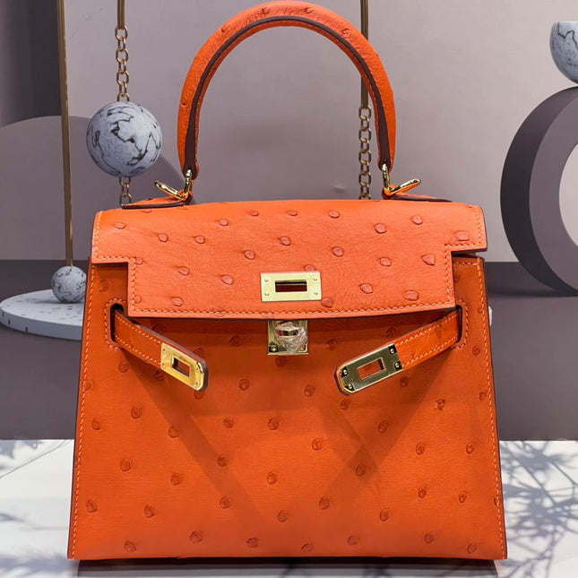KELLY BAG 20 IN FIRE ORANGE OSTRICH LEATHER WITH GOLD HARDWARE