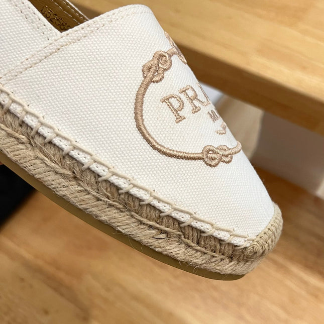 PRADA 26S EMBROIDERED LOGO ESPADRILLE FLATS IN IVORY WHITE CANVAS