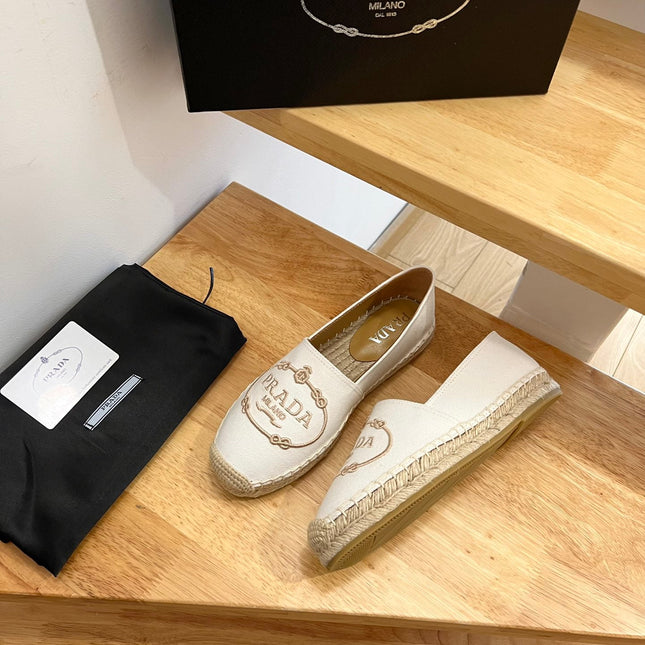 PRADA 26S EMBROIDERED LOGO ESPADRILLE FLATS IN IVORY WHITE CANVAS