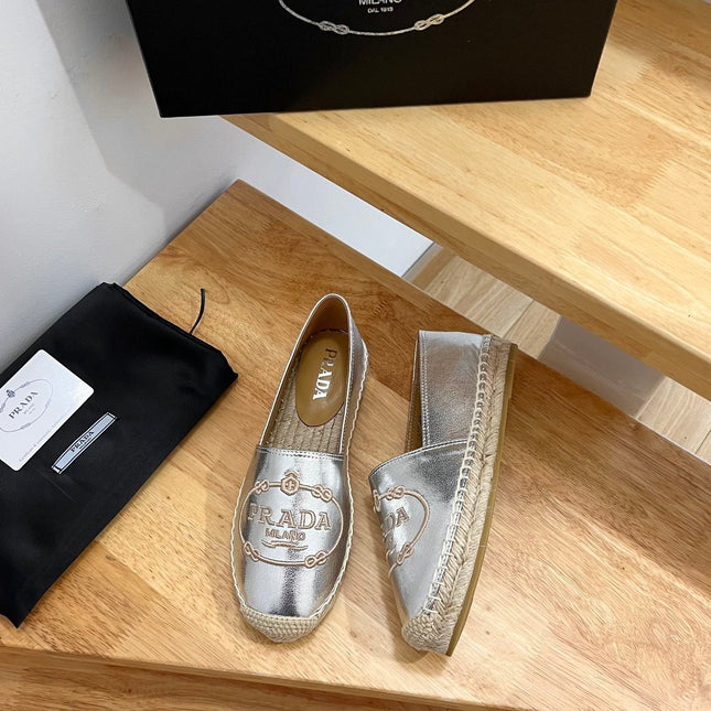 PRADA 26S EMBROIDERED LOGO ESPADRILLE FLATS IN SILVER CALFSKIN