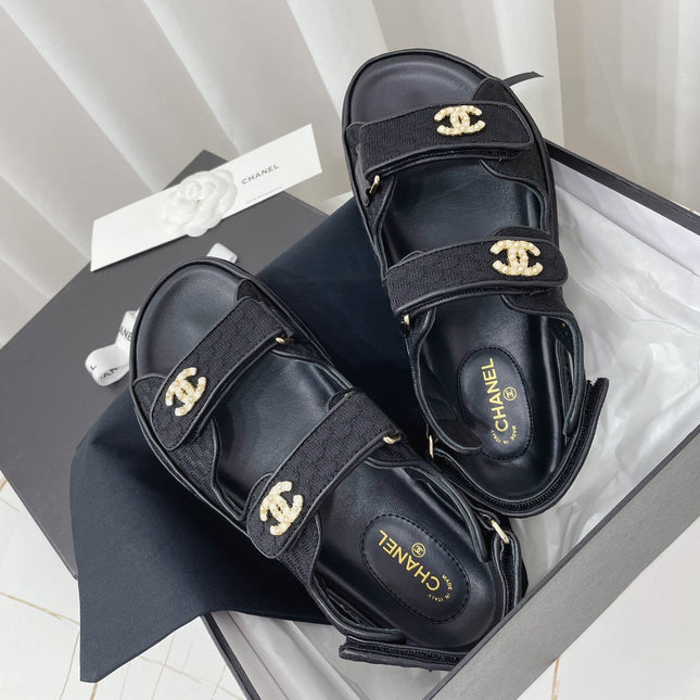CHANEL 26S SANDALS IN BLACK FABRIC WITH PEARL-EMBELLISHED LOGO