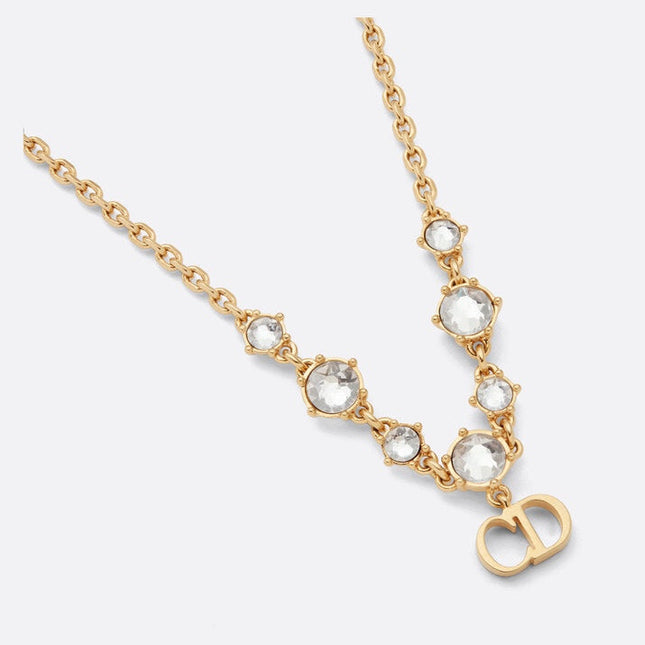 CD 26S CD LOGO CRYSTAL STATION NECKLACE IN GOLD TONE METAL WITH WHITE CRYSTAL 631006
