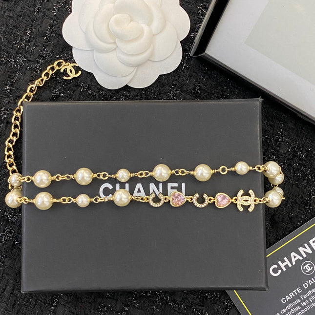 CHANEL 26S DOUBLE C LETTER PEARL NECKLACE WITH HEART CHARMS IN GOLD METAL 631850