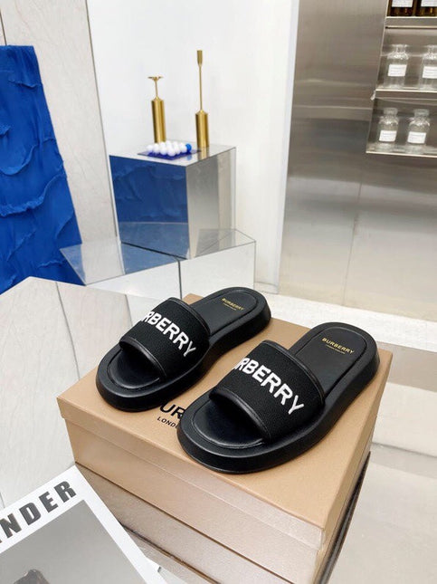 BURBERRY 26S SLIDE SANDALS IN BLACK CALFSKIN AND FABRIC