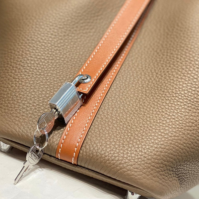 HERMES 25S PICOTIN LOCK 18 IN BURNT ORANGE AND BROWN CALFSKIN SILVER HARDWARE