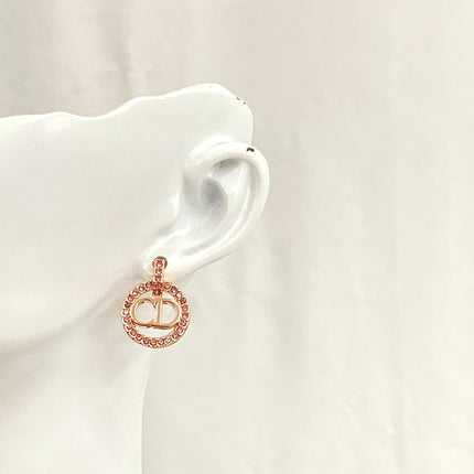 CD 26S CRYSTAL CIRCLE LOGO DROP EARRINGS IN ROSE GOLD TONE METAL 644468