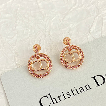 CD 26S CRYSTAL CIRCLE LOGO DROP EARRINGS IN ROSE GOLD TONE METAL 644468