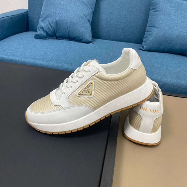 PRA SNEAKER IN WHITE CALFSKIN AND GOLD FABRIC WITH GOLDEN LOGO