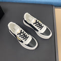 PRA SNEAKER IN WHITE CALFSKIN AND BLACK FABRIC WITH GOLDEN LOGO