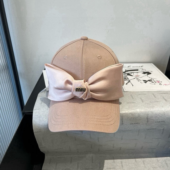 MIUMIU BASEBALL CAP IN BEIGE FABRIC WITH LARGE PINK BOW
