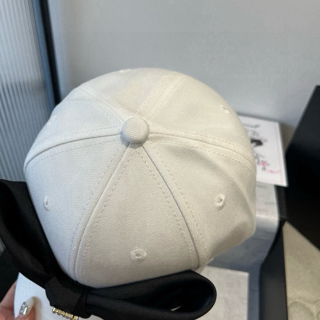 MIUMIU BASEBALL CAP IN WHITE FABRIC WITH LARGE BLACK BOW
