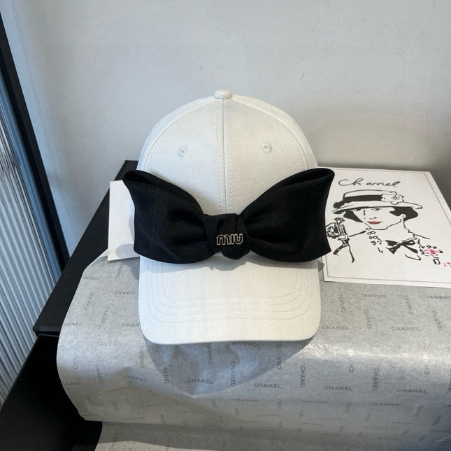 MIUMIU BASEBALL CAP IN WHITE FABRIC WITH LARGE BLACK BOW