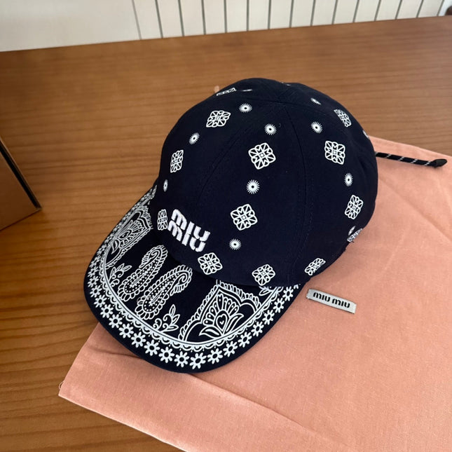 MIUMIU BASEBALL CAP IN BLACK WITH WHITE EMBROIDERED PATTERN