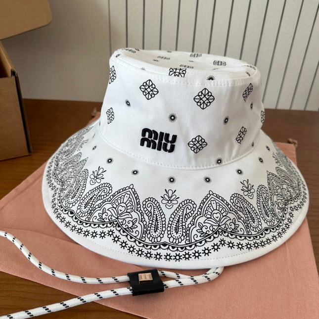 MIUMIU BUCKET IN WHITE FABRIC WITH BLACK EMBROIDERED PATTERN