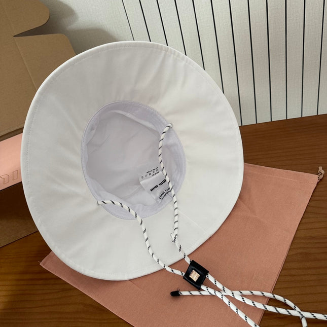 MIUMIU BUCKET IN WHITE FABRIC WITH BLACK EMBROIDERED PATTERN