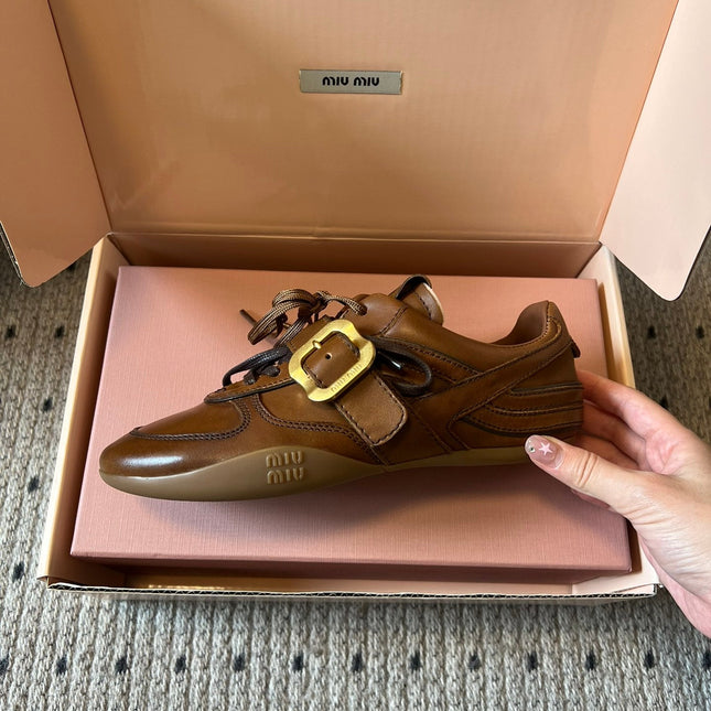 MIUMIU 26S GYMNASIUM SNEAKER IN COGNAC BROWN CALFSKIN WITH GOLD BUCKLED STRAP
