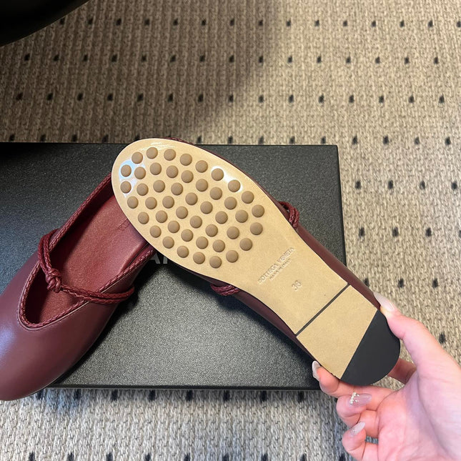 BOTTEGA VENETA 26S FLAT MULES IN DARK RED LAMBSKIN