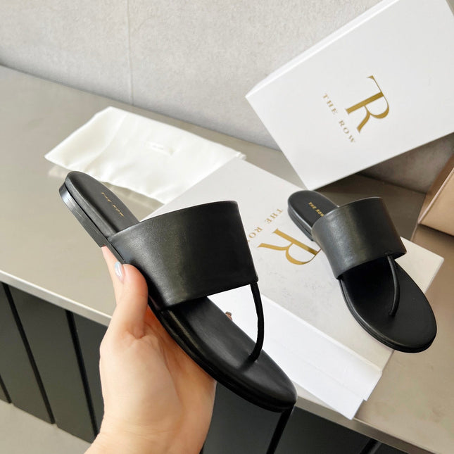 THE ROW 26S FLAT THONG SANDALS IN BLACK CALFSKIN