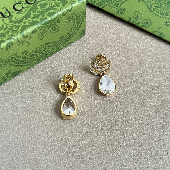 GUCCI 26S INTERLOCKING GG MINI CRYSTAL TEARDROP EARRINGS IN GOLD TONE METAL 620512