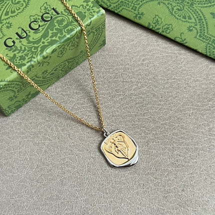 GUCCI 26S EMBLEM SHIELD PENDANT NECKLACE IN GOLD AND SILVER TONE METAL 625551