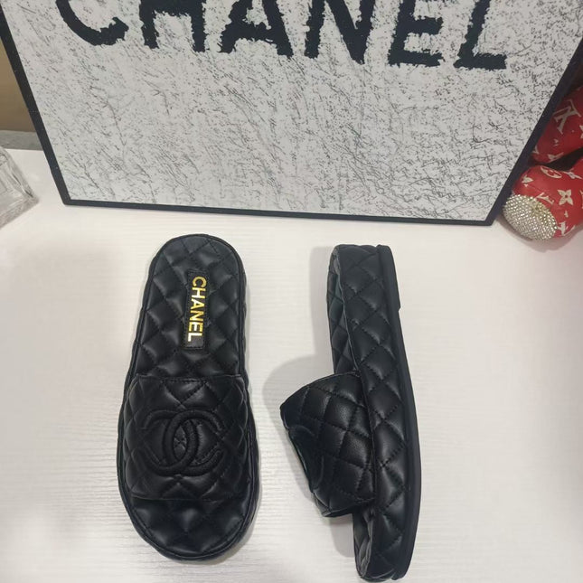 CHANEL 26S QUILTED SLIDE SANDALS IN BLACK CALFSKIN