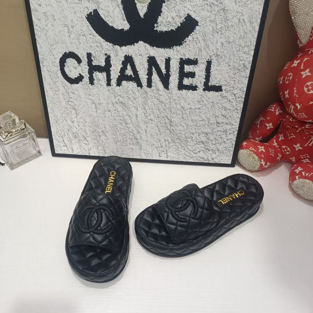 CHANEL 26S QUILTED SLIDE SANDALS IN BLACK CALFSKIN