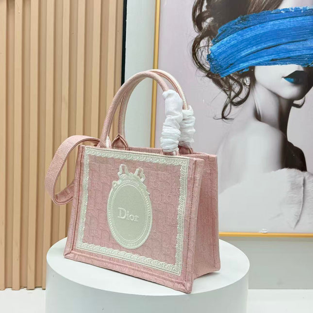 DIOR BOOK TOTE BAG 36 IN PINK COLORWAY WITH AN OVAL EMBROIDERED LOGO EMBLEM