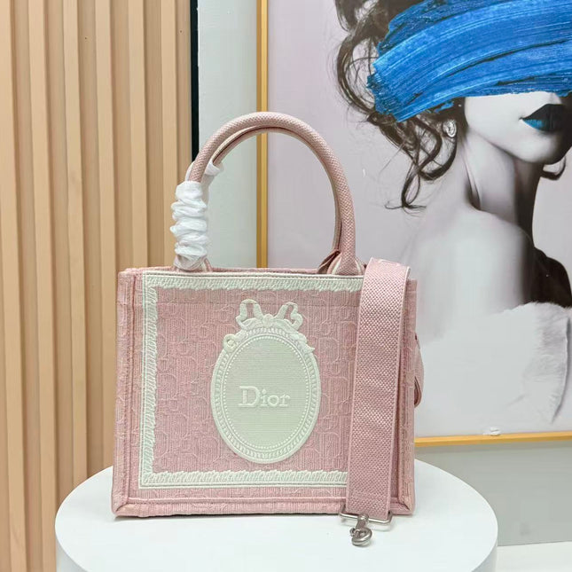 DIOR BOOK TOTE BAG 36 IN PINK COLORWAY WITH AN OVAL EMBROIDERED LOGO EMBLEM