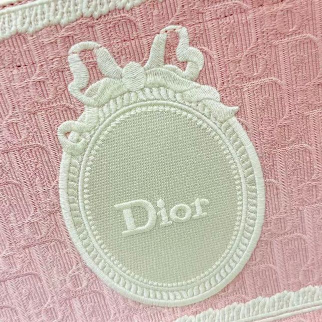 DIOR BOOK TOTE BAG 36 IN PINK COLORWAY WITH AN OVAL EMBROIDERED LOGO EMBLEM