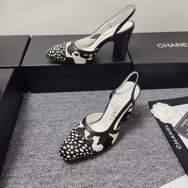 CHANEL SLINGBACK HEELS IN BLACK AND WHITE COW PRINT