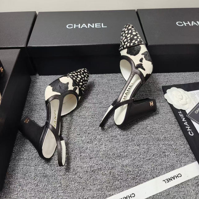 CHANEL SLINGBACK HEELS IN BLACK AND WHITE COW PRINT