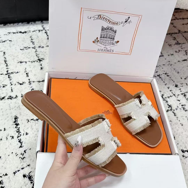 HERMES 26S ORAN FRINGED SLIDE SANDALS IN ECRU CANVAS