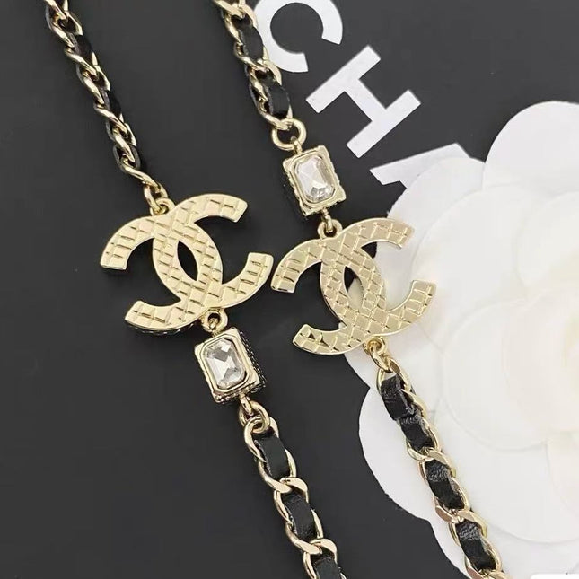 GOLD-TONE CHANEL CHAIN BELT WITH BLACK ENAMEL AND CRYSTAL-ENCRUSTED INTERLOCKING CC CHARMS