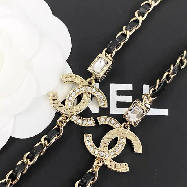 GOLD-TONE CHANEL CHAIN BELT WITH BLACK ENAMEL AND CRYSTAL-ENCRUSTED INTERLOCKING CC CHARMS