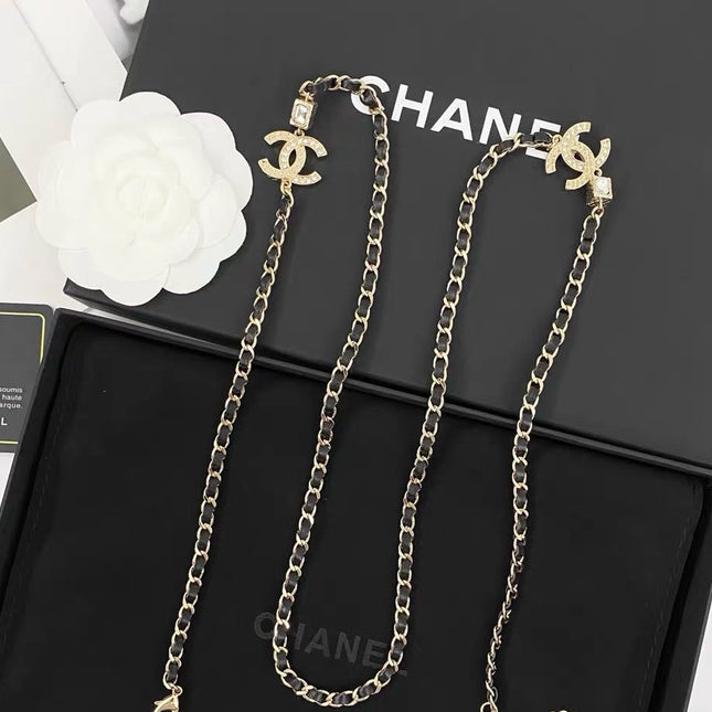 GOLD-TONE CHANEL CHAIN BELT WITH BLACK ENAMEL AND CRYSTAL-ENCRUSTED INTERLOCKING CC CHARMS