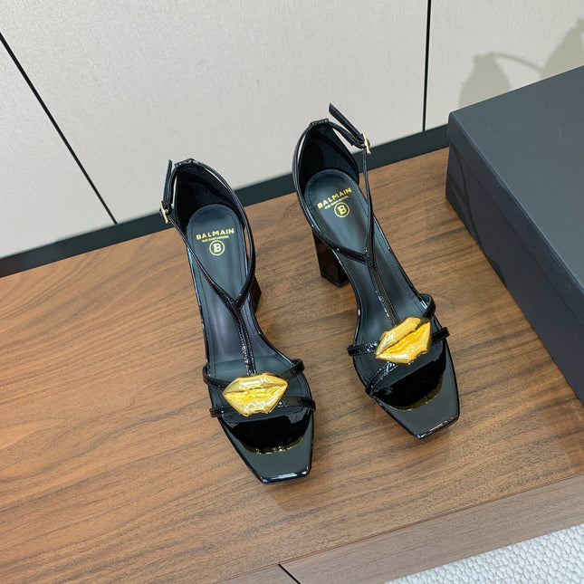 BALMAIN 26S LIP-EMBELLISHED HEELS 105 MM IN BLACK CALFSKIN WITH GOLD HARDWARE