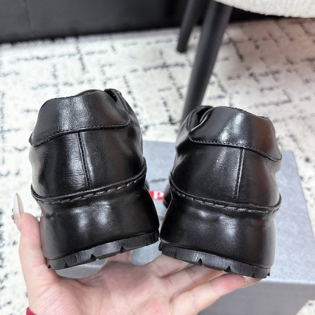 PRADA 26S SNEAKERS IN BLACK SHINY CALFSKIN
