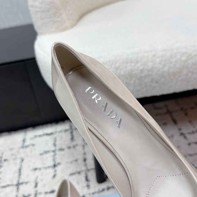 PRADA 26S POINTED-TOE HIGH HEELS 60MM IN CREAM WHITE PATENT CALFSKIN WITH LOGO