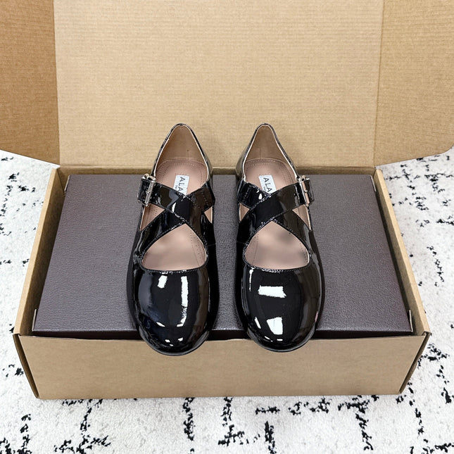 ALAIA 26S CROSS-STRAP BALLET FLATS IN BLACK GLOSSY LAMBSKIN